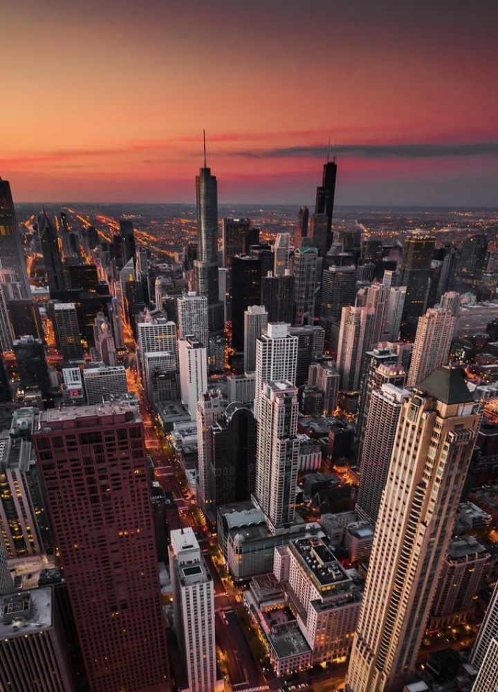 arial view of a city skyline at sunset